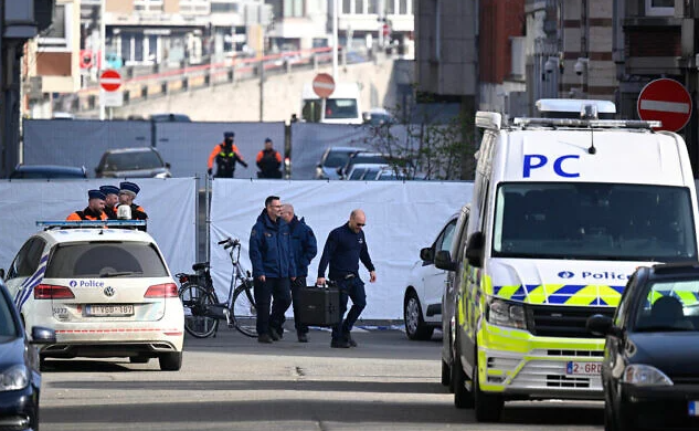 Belgian police conduct their investigation outside a synagogue that was his by a blast overnight in Liege, Belgium, March 9, 2026. (John Thys/AFP)
