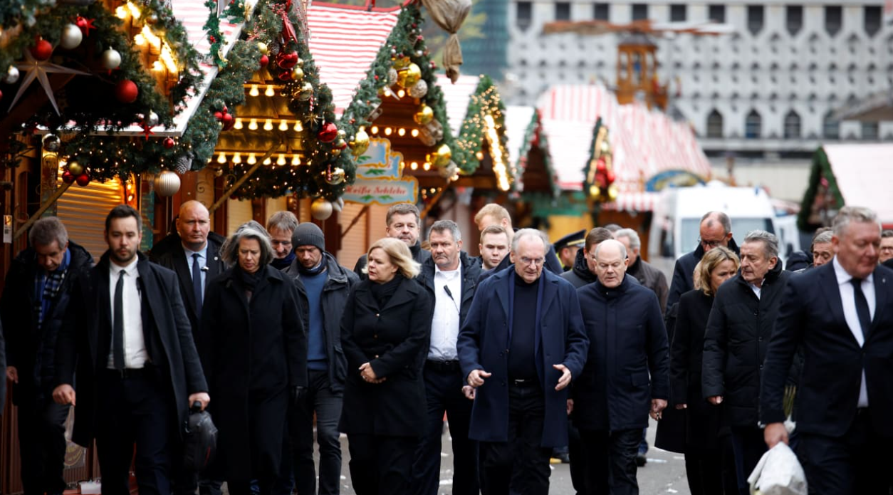 German Chancellor Olaf Scholz, Prime Minister of Saxony-Anhalt Reiner Haseloff and German Interior Minister Nancy Faeser visit the site where a car drove into a crowd of a Christmas market in Magdeburg, Germany December 21, 2024.