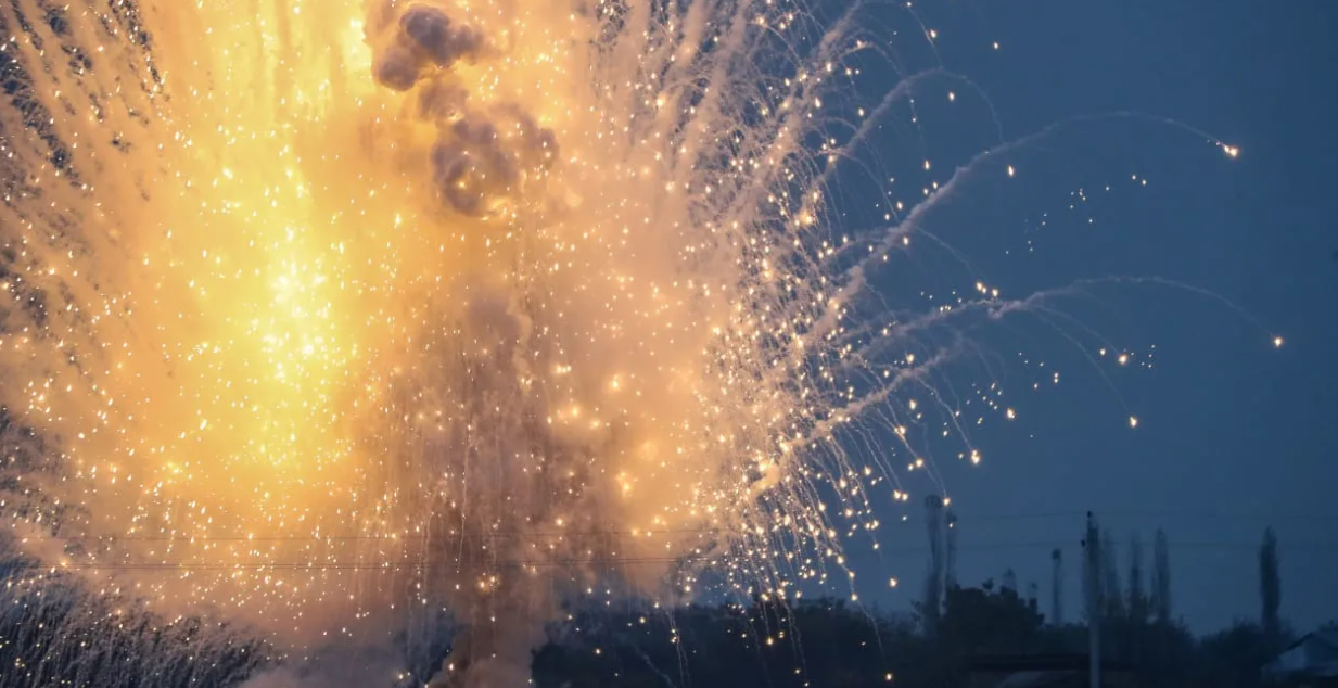 Unexploded ordinance, an artillery shell containing white phosphorous, is detonate (photo credit: AZIZ KARIMOV/GETTY IMAGES)