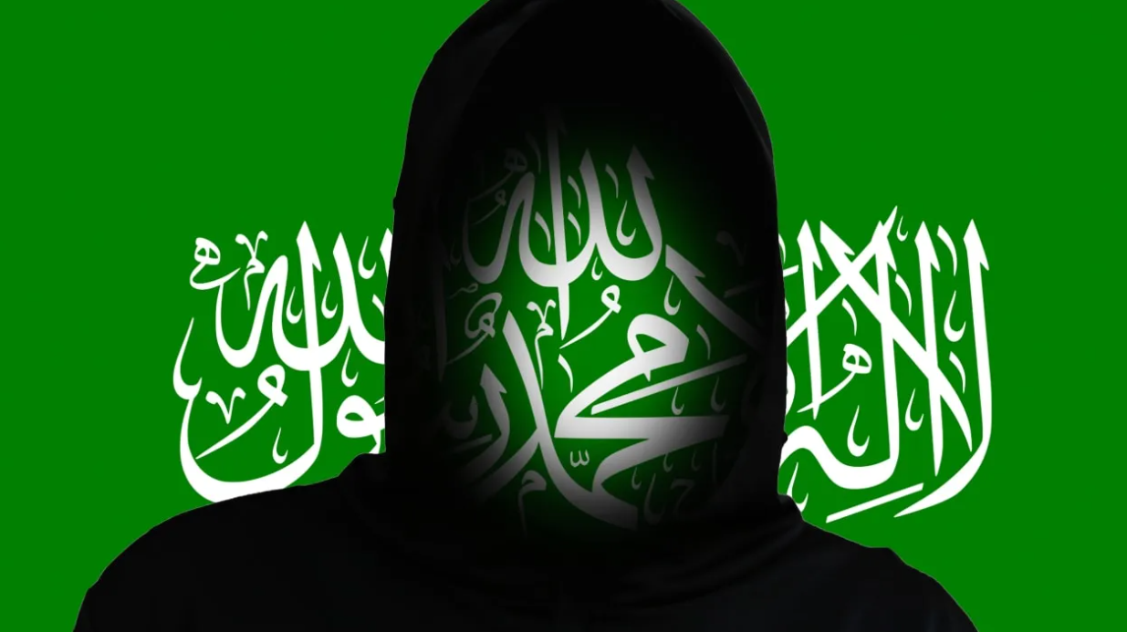 An illustrative image of a silhouette over the backdrop of the Hamas flag. (photo credit: tanitost/Shutterstock)