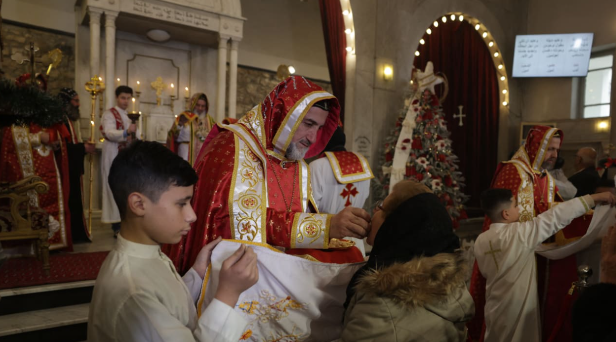 Clergymen lead Christmas celebrations at the St. George's Syriac Orthodox Church in the old city of Damascus. (photo credit: BAKR ALKASEM/AFP via Getty Images)