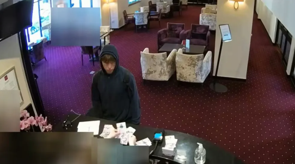 Johannes Natland, 19, at the reception desk of the Briar Court Hotel in Huddersfield, England. Credit: Metropolitan Police.