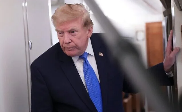 US President Donald Trump speaks to reporters onboard Air Force One while returning to the White House, August 2, 2026. (AP Photo/Jacquelyn Martin)