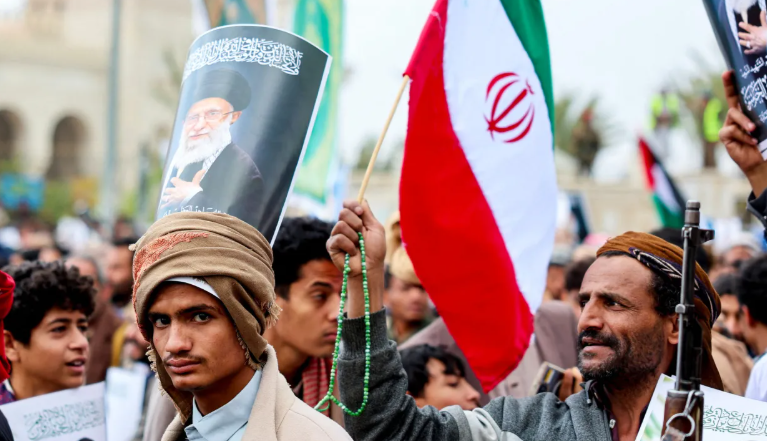 A protester holding a poster of the late Iranian supreme leader, Ayatollah Ali Khamenei, joins Houthi supporters demonstrating in solidarity with Iran and Lebanon in Sanaa, Yemen, March 6, 2026.(Khaled Abdullah/Reuters)