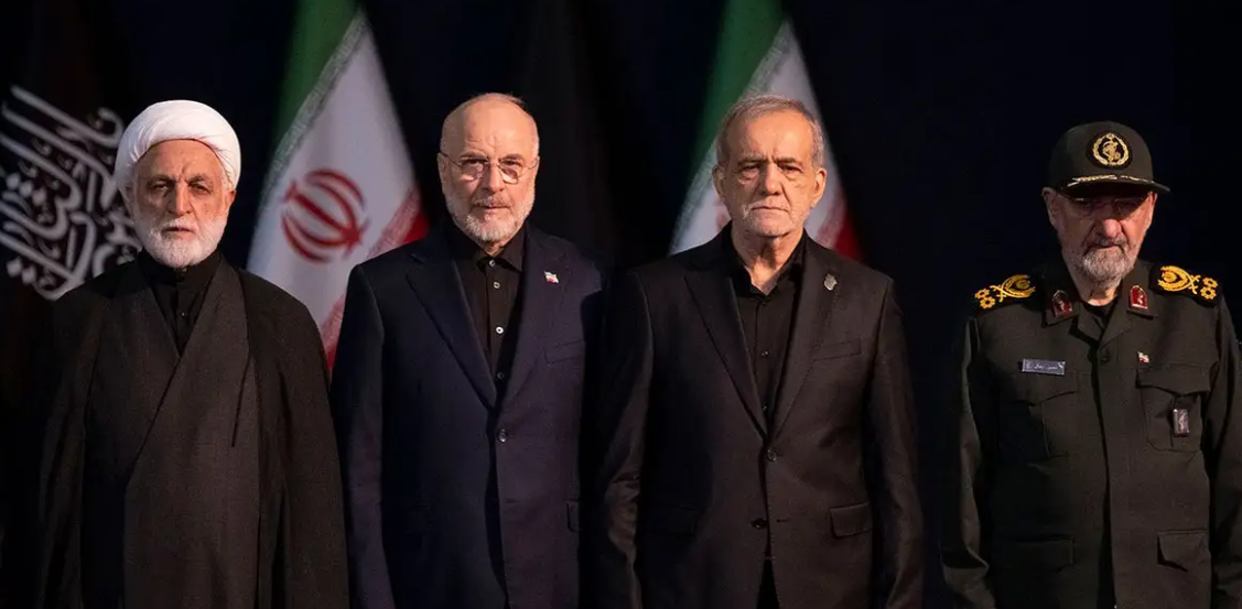 Iranian Parliament Speaker Mohammad Bagher Ghalibaf, Chief Justice of Iran Gholam-Hossein Mohseni-Eje'i, Iranian President Masoud Pezeshkian and IRGC Commander General Mohsen Rezaee attend a ceremony in Tehran, Iran, July 3, 2026. (Morteza Nikoubazl/NurPhoto via Getty Images)