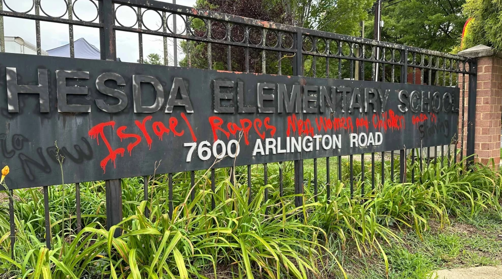 Anti-Israel graffiti was spray-painted in red on the main sign of Bethesda Elementary School in Maryland, August 2024. Credit: Courtesy of the Anti-Defamation League.
