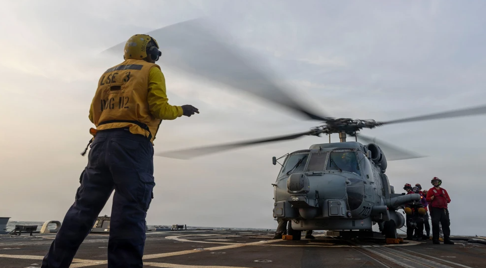 A U.S. Navy MH-60R Sea Hawk helicopter is readied for flight aboard the guided-missile destroyer USS Michael Murphy as the warship supports the U.S. blockade of Iran in regional waters. Credit: United States Central Command.