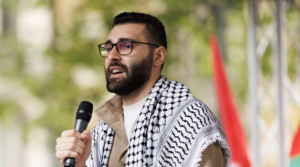 Palestinian photojournalist Mu’taz Azaiza speaks to the crowd at the end of the “14th National March For Palestine” in London, England, May 18, 2024. Photo by Dan Kitwood/Getty Images.Dan Kitwood/Getty Images