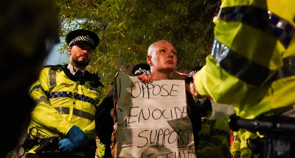 A protester is detained by Police outside the conference venue during the Mass Action Protest in support of the proscribed group Palestine Action on the first day of the Labour Party Conference at Liverpool Experience Campus. (photo credit: Ian Forsyth/Getty Images)