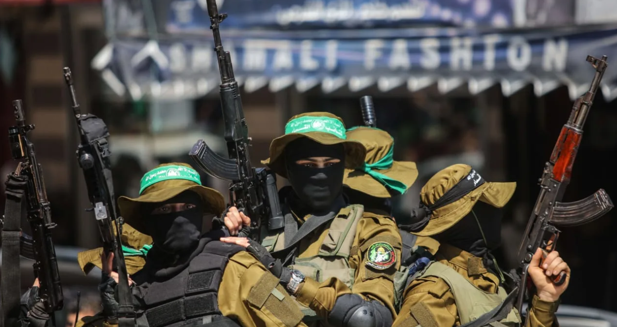 Masked gunmen from the Qassam brigade, the militia wing of Hamas, attend the funeral of Mazen Faqha in Gaza City, Saturday, March, 25, 2017. The former Palestinian prisoner whom Israel sent to Gaza after his release was found shot dead at the entrance of his house in Gaza City. (photo credit: Wissam Nassar/Flash90.)