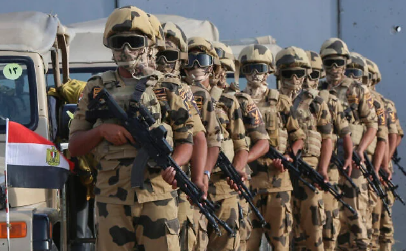 FILE: Egyptian military personnel stand alert at the Rafah border crossing, in Rafah, Egypt, October 31, 2023. (AP Photo/Mohammed Asad)