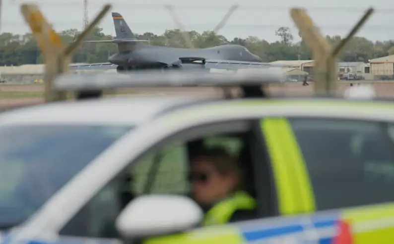 A B1 bomber prepares to take off as police officers man a checkpoint near RAF Fairford air base, in Fairford, England, September 29, 2026. (AP Photo/Alastair Grant)